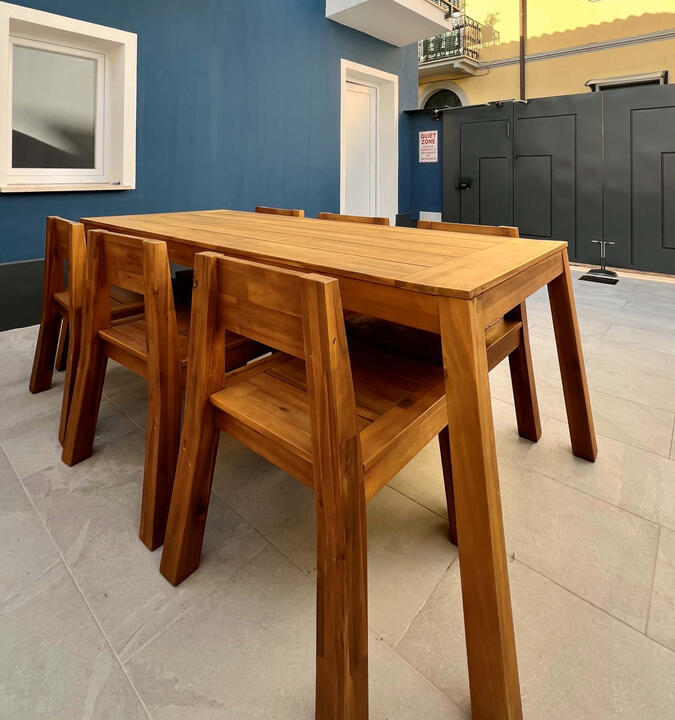 Spacious private terrace with a dining table for six — perfect for al fresco meals. Spacious private terrace with a dining table for six — perfect for al fresco meals.