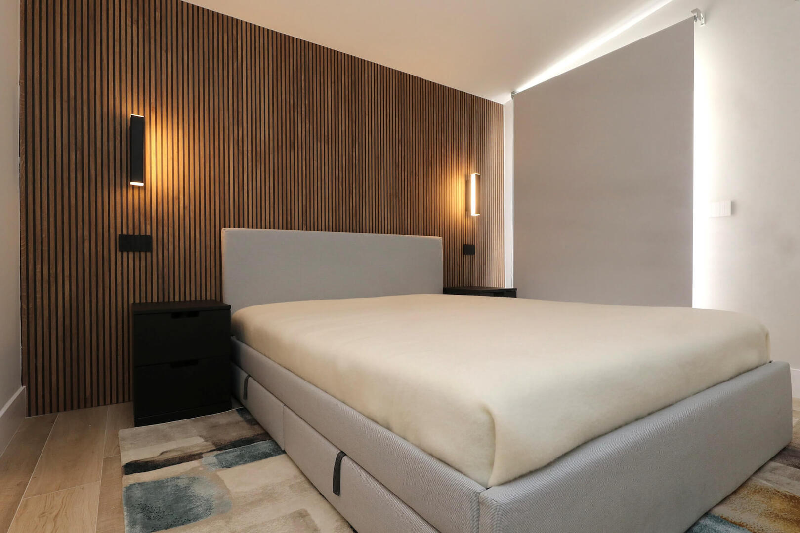 Spacious bedroom with a high-quality mattress.